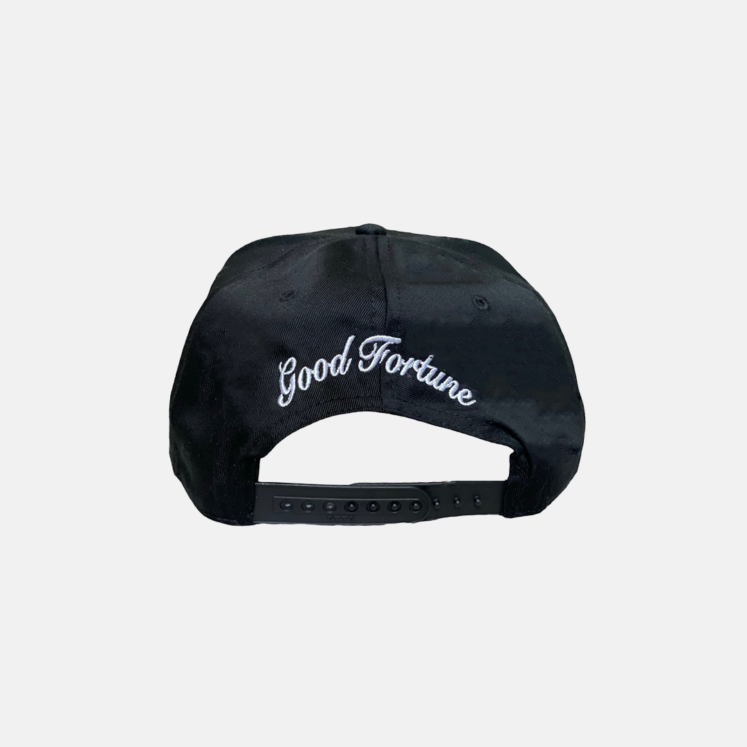Black Trucker Hat with a White Logo on the Front, Adjustable Strap, Curved Brim, and Good Fortune curved in the back
