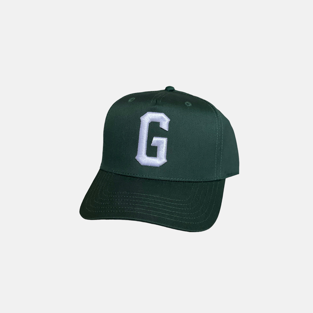 Forest Green Trucker Hat with a White Logo on the Front, Adjustable Strap, Curved Brim, and Good Fortune curved in the back