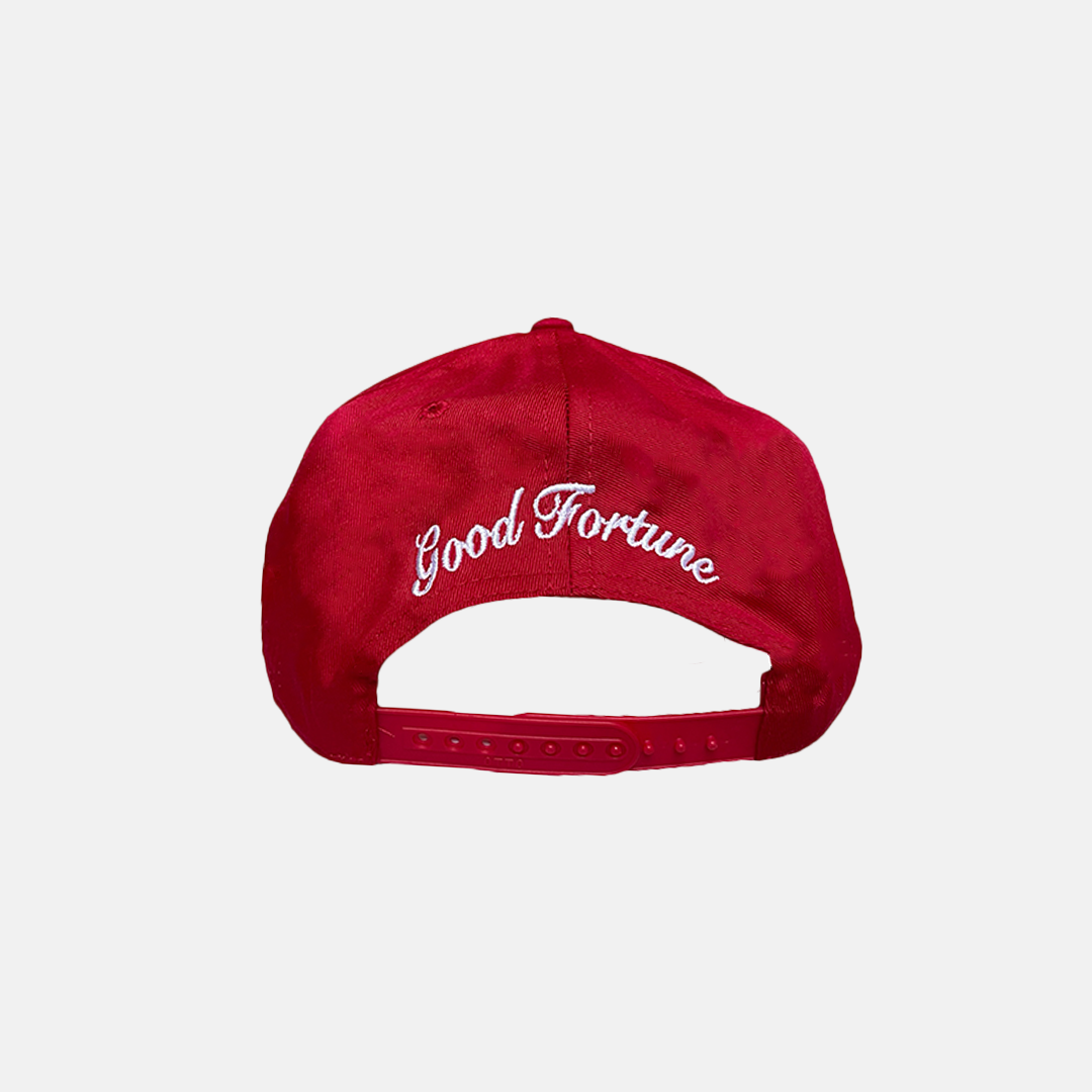 Red Trucker Hat with a White Logo on the Front, Adjustable Strap, Curved Brim, and Good Fortune curved in the back